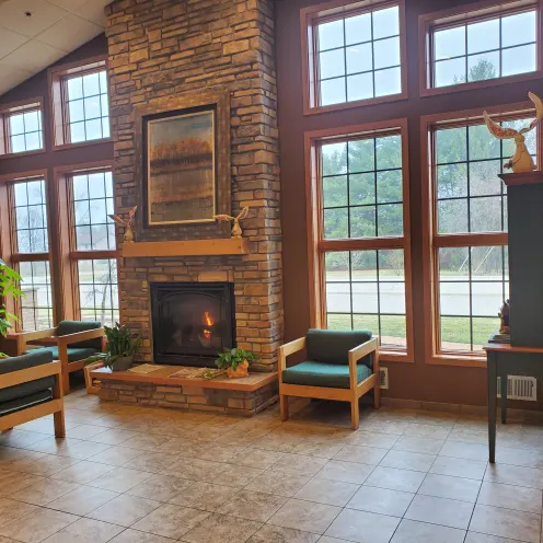 Lobby with fireplace and chairs at Willow Springs Veterinary Clinic 